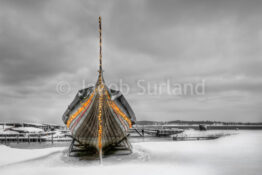 On a cold winters morning I found the Sea Stallion sitting alone on the land, wrapped in Christmas lights. The Sea Stallion is the world's largest reproduction of a Viking ship. The Viking Ship Museum in Roskilde owns the Sea Stallion. Photo by: Jacob Surland, www.caughtinpixels.com