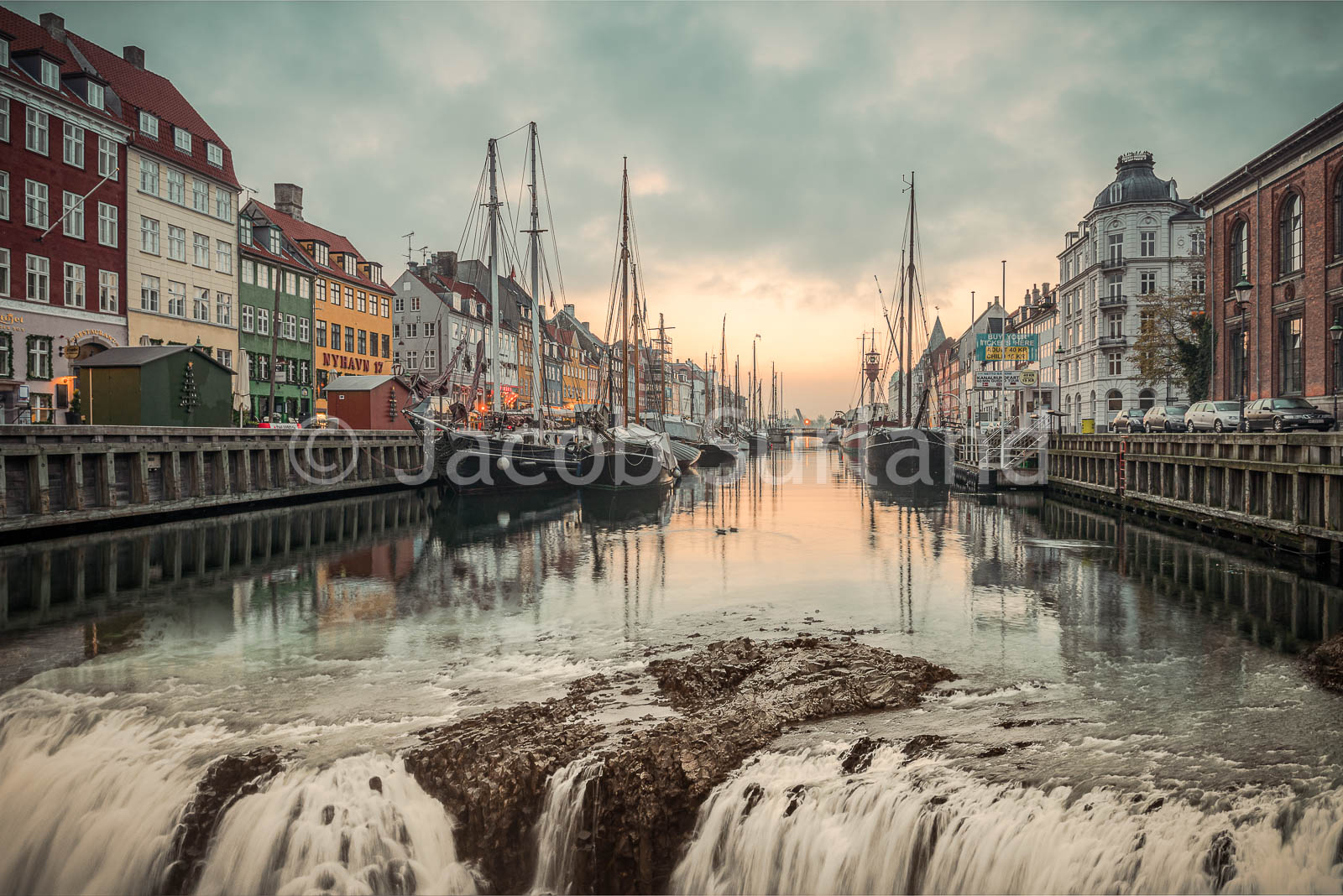 The water is runing out of Nyhavn. A composite surreal image.